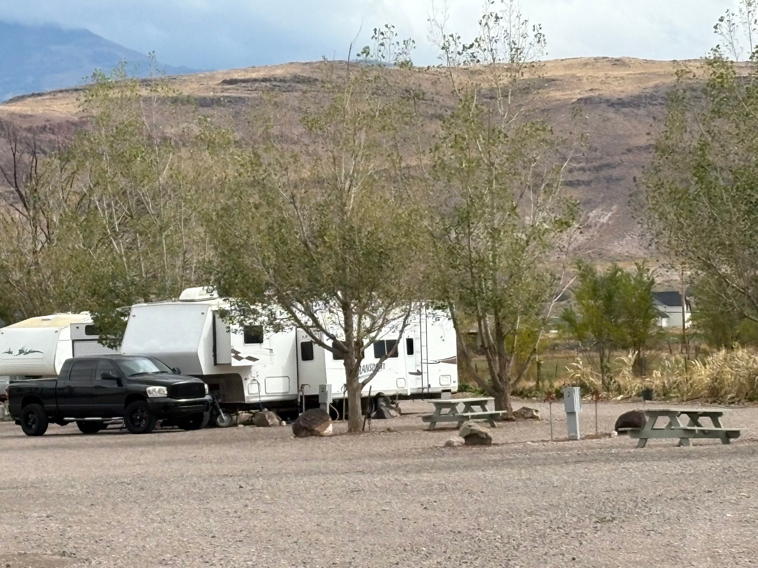 camp trailer parked in a spot at Flying U Campground